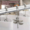 A set of silver dragonfly shower curtain hooks gliding effortlessly across a metal shower rod.