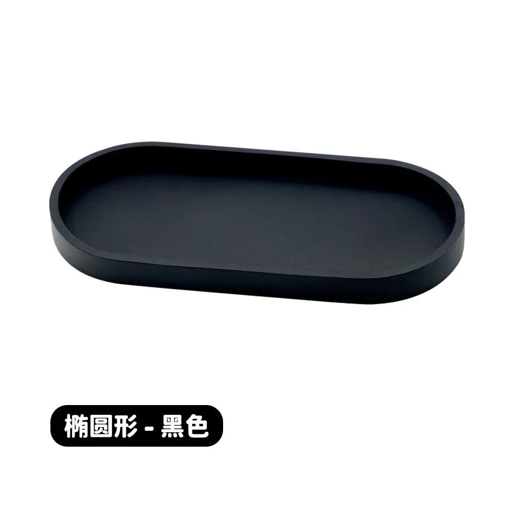 Black silicone tray organizer with a rectangular shape.