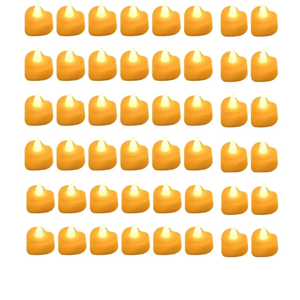 A grid of romantic LED heart tea lights with artificial rose petals in various shades of yellow.