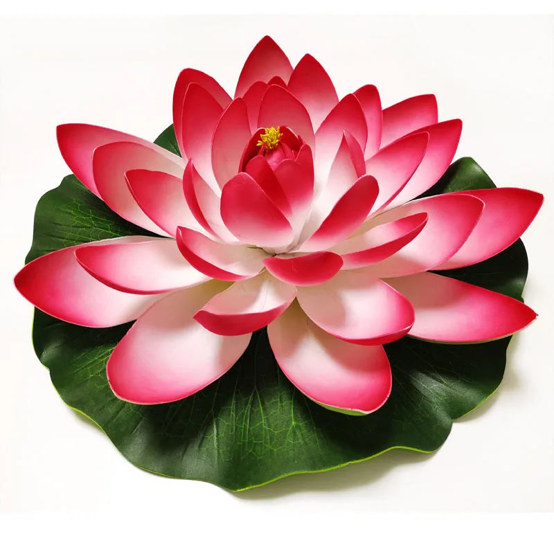 A vibrant pink artificial lotus flower with green leaves.