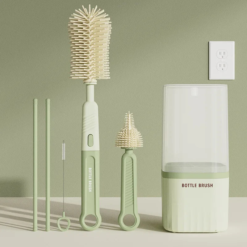A set of silicone bottle brushes and a drying rack displayed against a light green background.