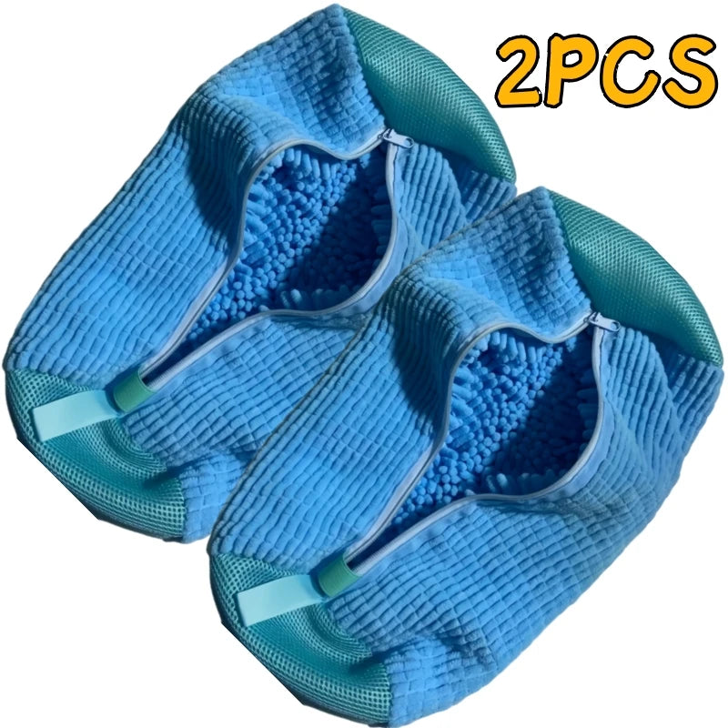 A pair of blue microfiber shoe cleaning brushes with storage bags shown in a close-up view.