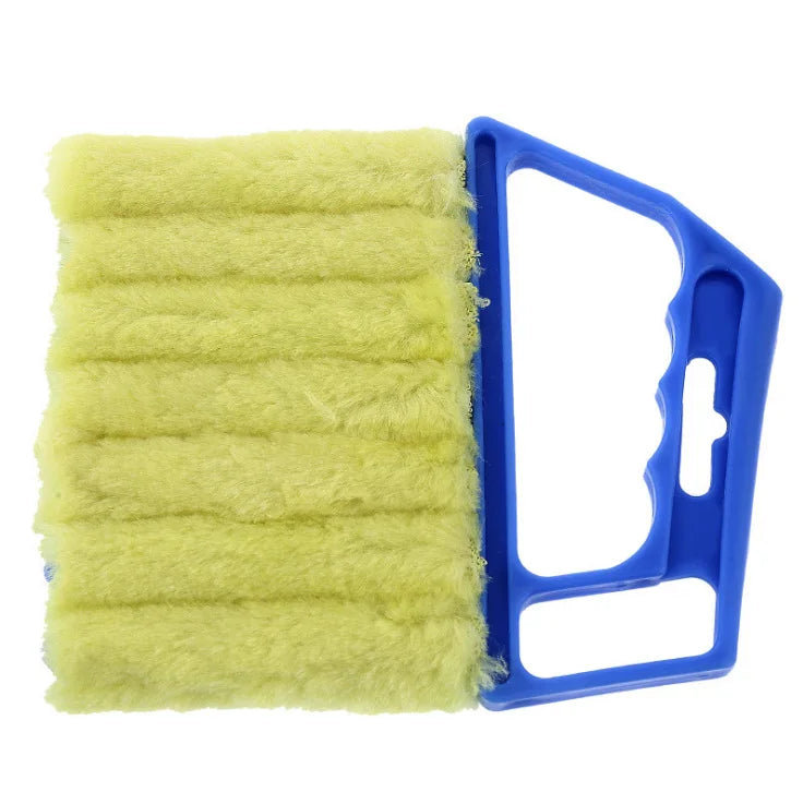A yellow multi-functional cleaning brush with a blue handle is shown.