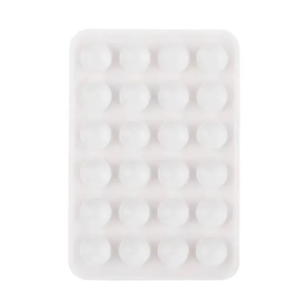 A white silicone suction cup phone stand with multiple holes for hands-free viewing.