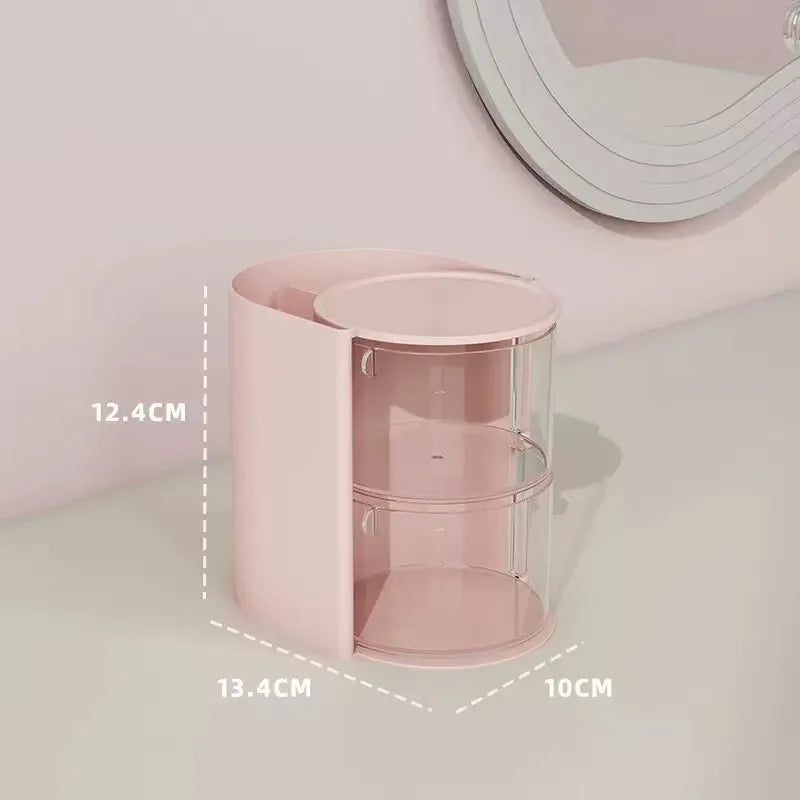 A pink acrylic rotating organizer for hair accessories and makeup, shown in a vertical view.