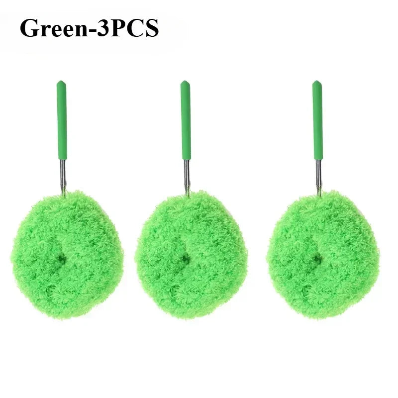 Three green extendable microfiber dusters with long handles.
