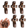 A set of handcrafted wooden pocket crosses for stress relief, showing various designs and sizes.
