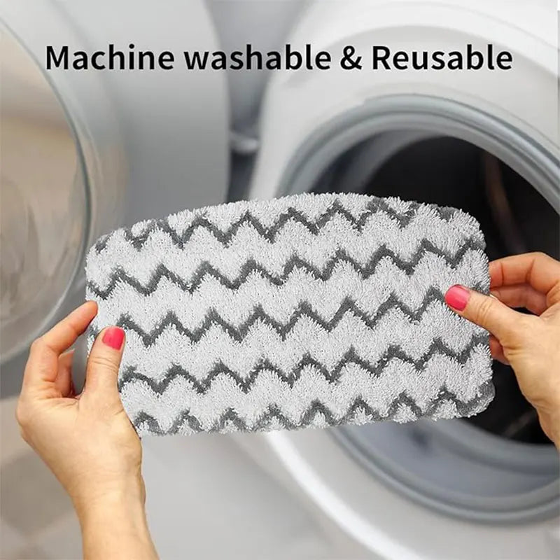 Hands holding a gray and white textured microfiber pad for a machine washable and reusable mop.