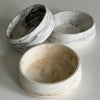 Three white silicone resin molds with marbled gray patterns for baking and crafts
