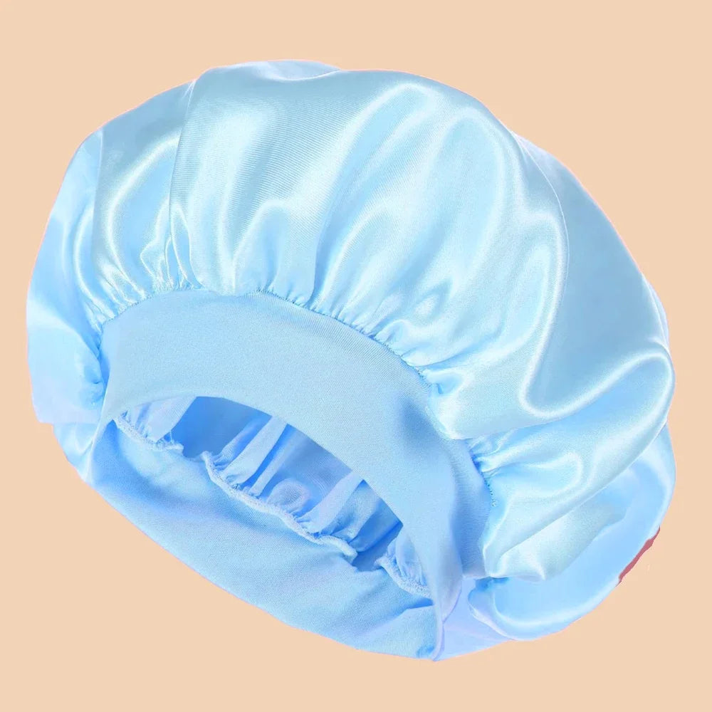 Light blue satin wide brim shower cap shown from above