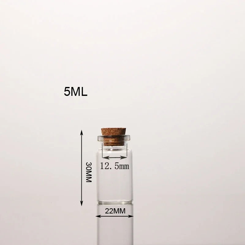 Flacon de potion en verre transparent avec bouchon en liège, étiqueté 5ML et mesurant 12,5mm par 22mm.