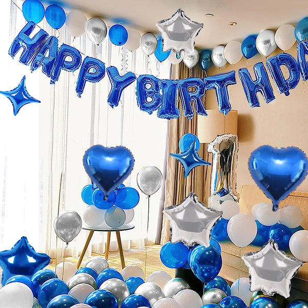 A decorative banner and cluster of blue and silver balloons for a birthday party celebration