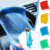 A hand holds a blue universal dust and debris remover gel kit, showing various colors of the cleaning gel.