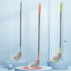 A set of three bucket cleaning brushes with stainless steel handles and various colored bristles displayed against a light bl