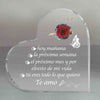 Placa de acrílico con forma de corazón grabada con una rosa roja y una mariposa, con texto en español que expresa amor.