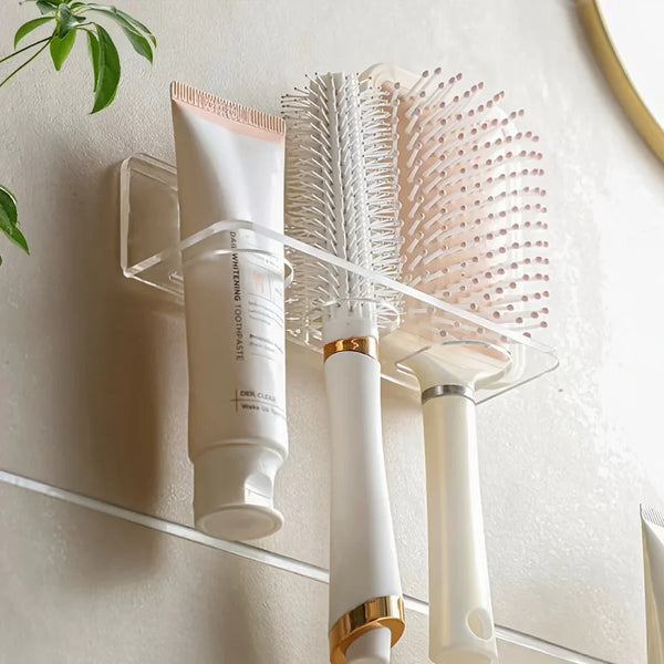 A white bottle of Der Clea whitening toothpaste is displayed on a No-Drill Acrylic Bathroom Organizer Rack with a white brush