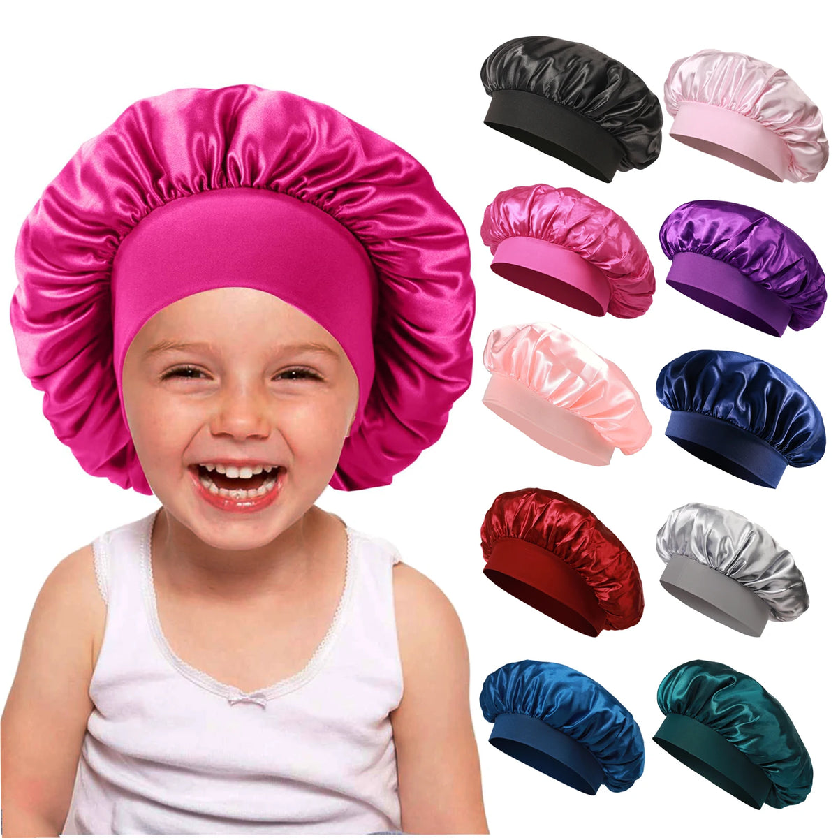 A toddler is smiling while wearing a bright pink satin sleep bonnet, with various colored bonnets shown nearby.
