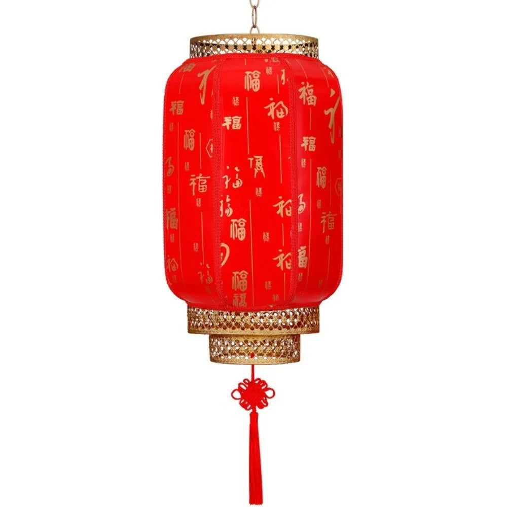 A durable antiqued red Chinese lantern with gold accents and decorative script.