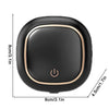 A black portable UV electric toothbrush cleaner with a round shape and a power button symbol.