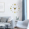 A modern living room features a frameless antique style wall clock with gold numerals on a white wall.