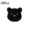 A small, black, fuzzy cat-shaped pet hair remover sponge.