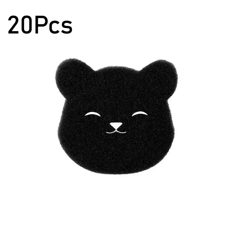 A small, black, fuzzy cat-shaped pet hair remover sponge.
