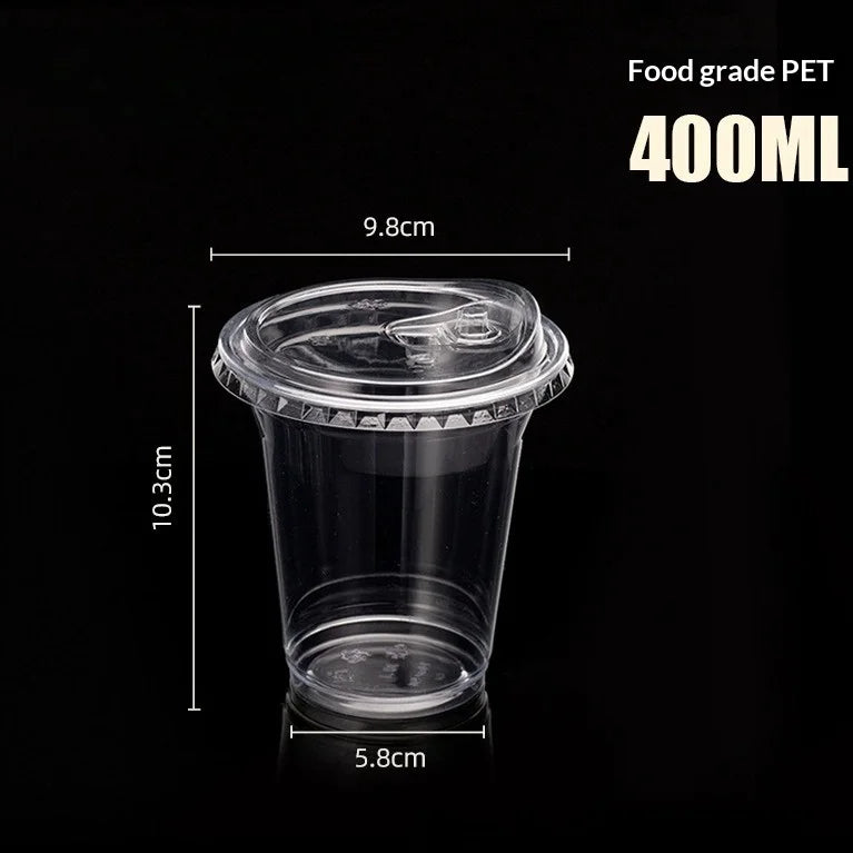 A clear food grade PET disposable coffee cup with a lid, shown against a black background.