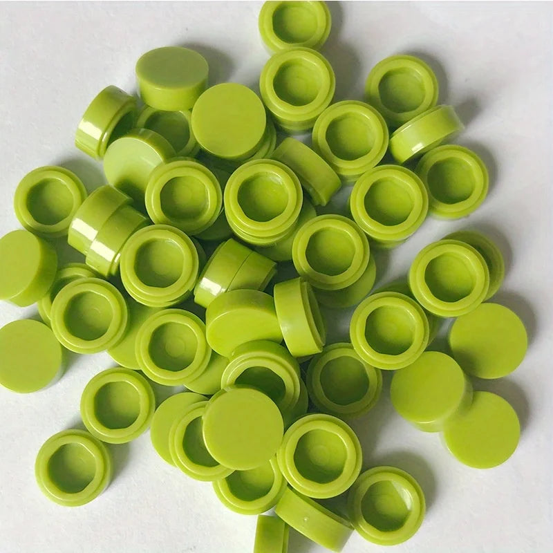 A collection of round, lime green building blocks for DIY projects.