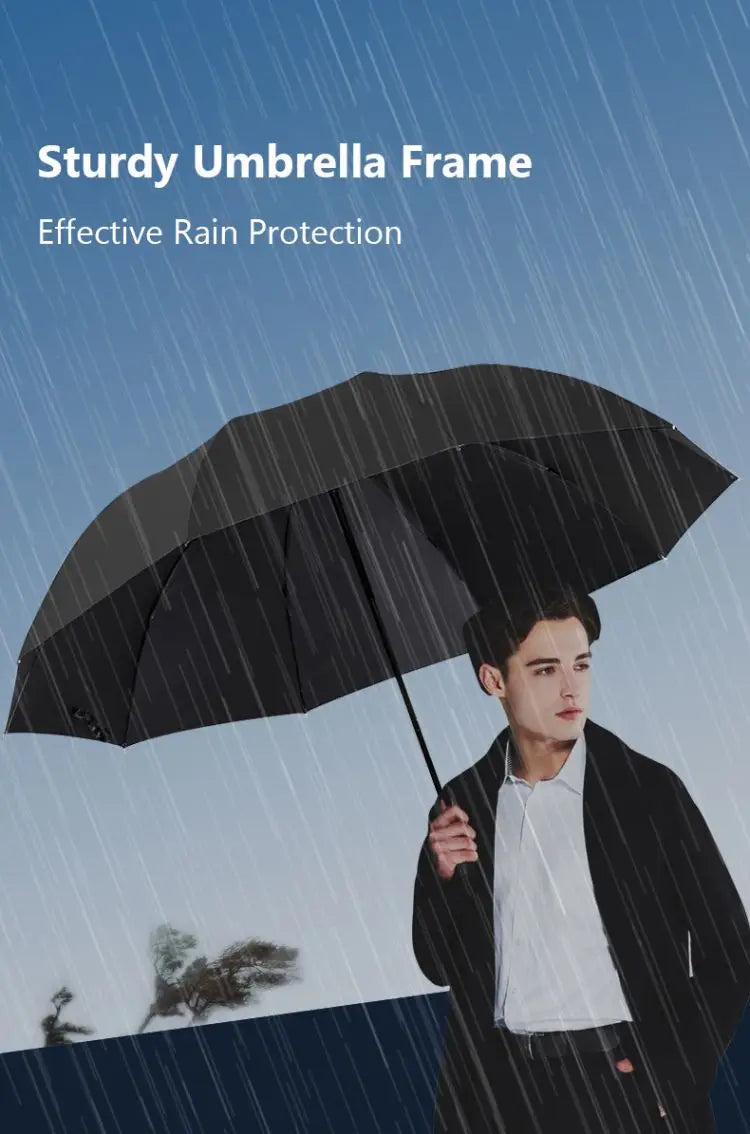 A man holding a sturdy black umbrella in the rain against a blue sky background.