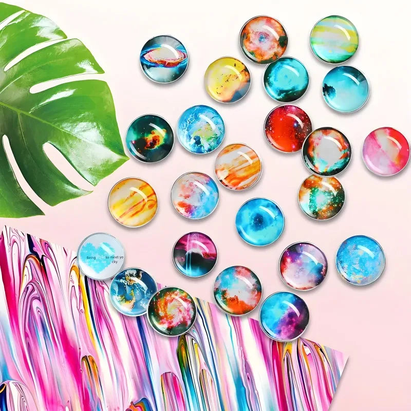 A collection of colorful, iridescent glass refrigerator magnets featuring abstract floral and oceanic designs.