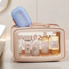 A light blue leakproof travel soap container is placed inside a pink plastic storage box.