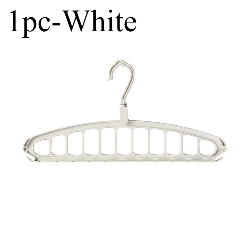 A single white foldable multi-hole space-saving laundry drying rack.