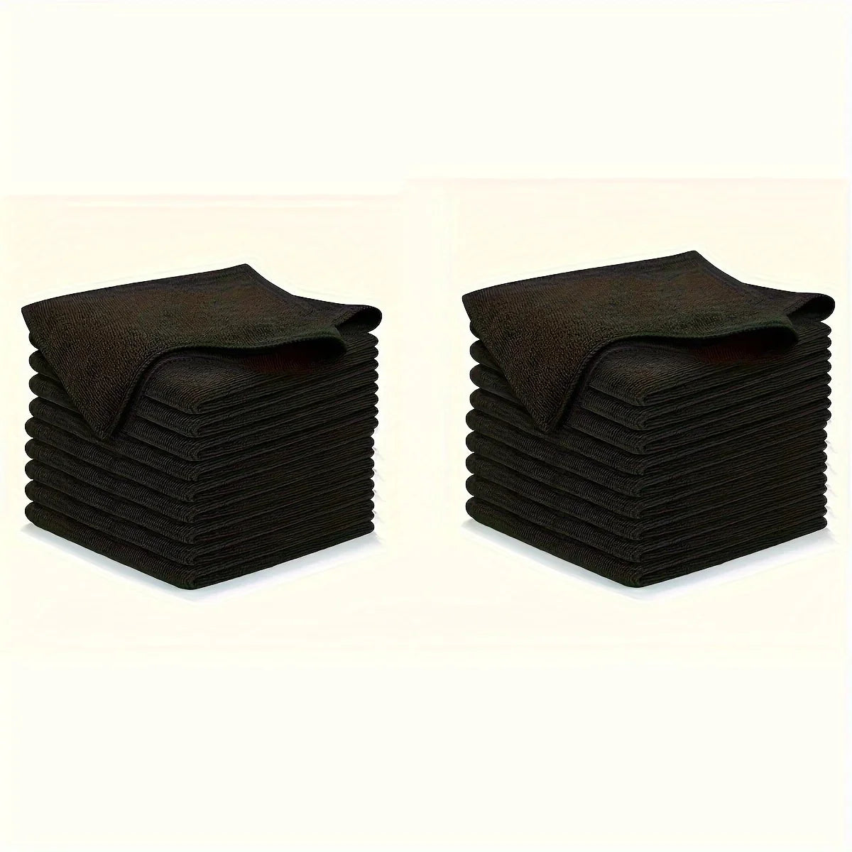 A stack of black reusable microfiber cleaning cloths.