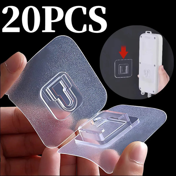 A hand holds a clear double-sided adhesive wall hook, showing the product and packaging count of 20 pieces.