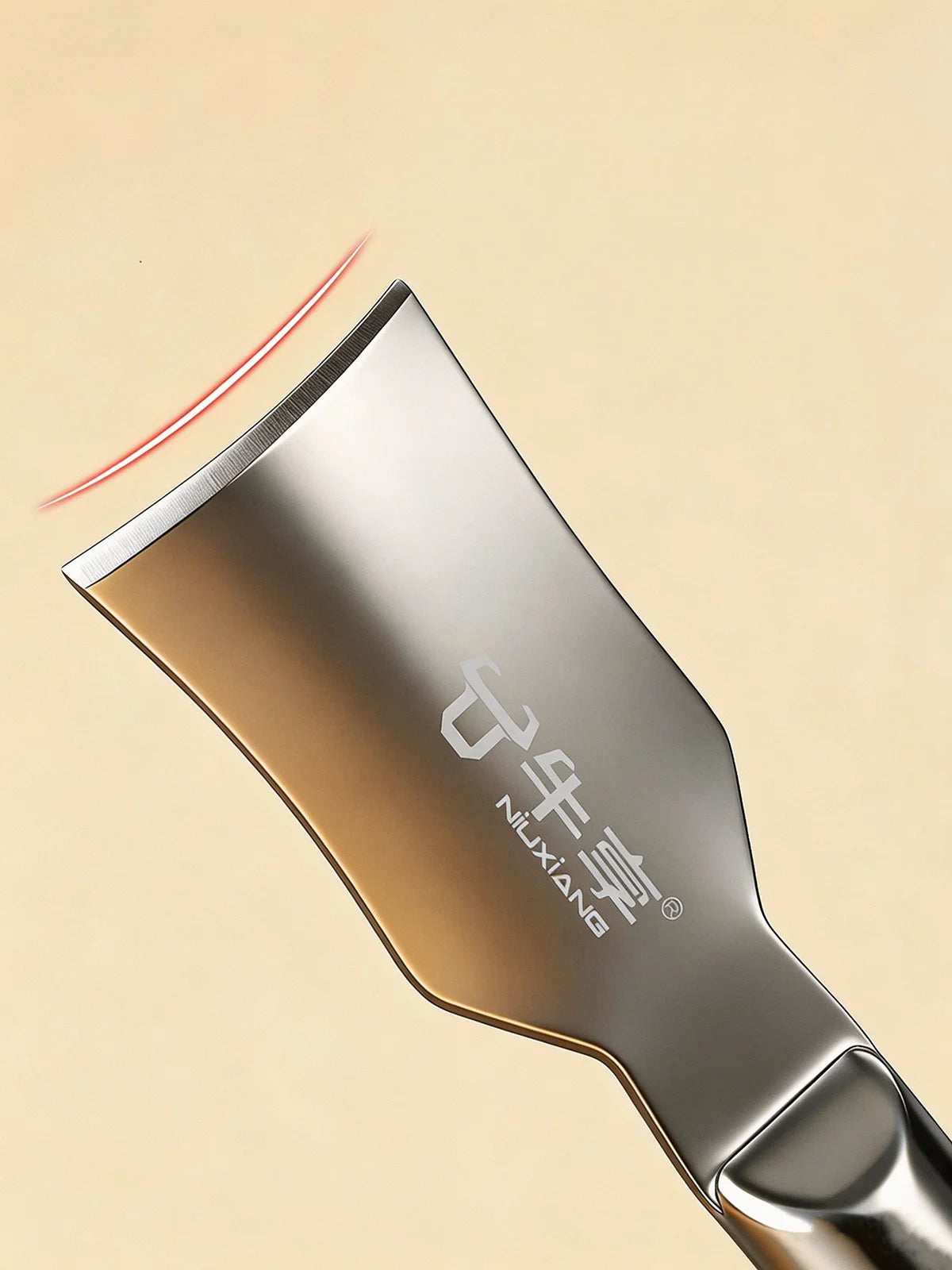 A close-up view of a stainless steel corn kernel remover peeler with a reddish line indicating action.