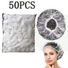 50 pieces of disposable transparent shower caps and a woman wearing one