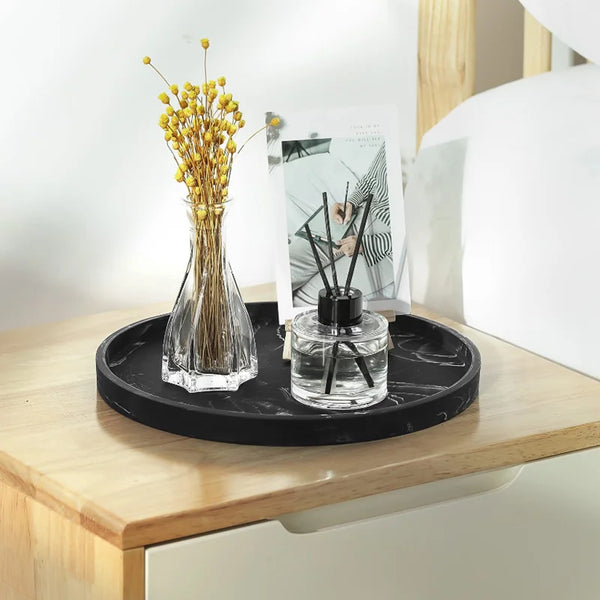A silicone tray organizer set featuring a glass vase with dried yellow flowers and a glass jar on a wooden surface.
