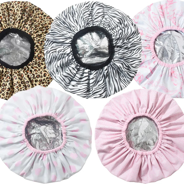 A collection of pink, white, and leopard print self-heating tin foil hair mask caps.