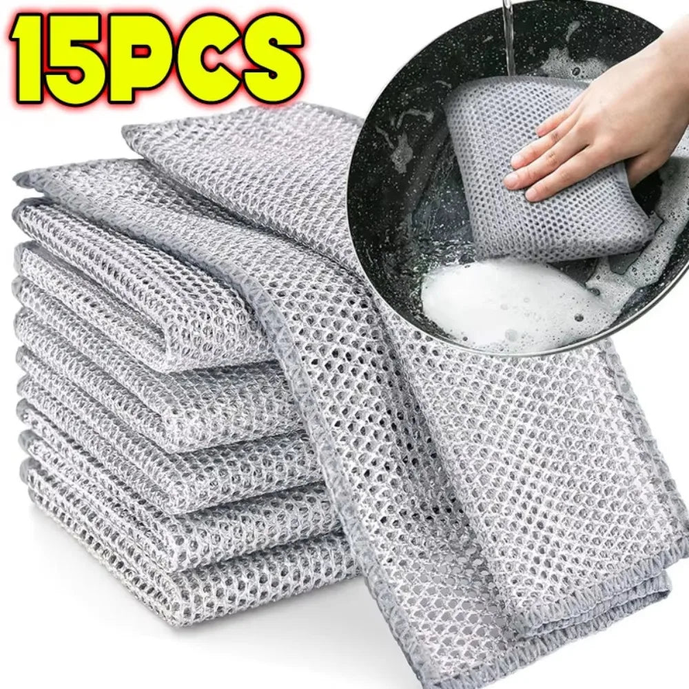 A stack of 15 pieces of gray thickened metal wire cleaning cloths being used in a black bowl.