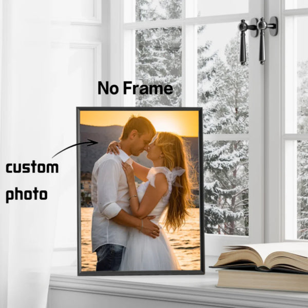 A custom photo canvas print of a couple embracing is displayed on a windowsill.