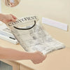 A hand holds an elastic mesh bag with the word CONVENIENT printed on it, demonstrating kitchen organization.