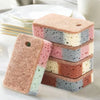 A stack of five eco-friendly double-sided cleaning sponges in pink, blue, and white colors.