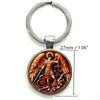 Silver keychain featuring a round pendant depicting the Saint Michael Archangel with wings and a sword.