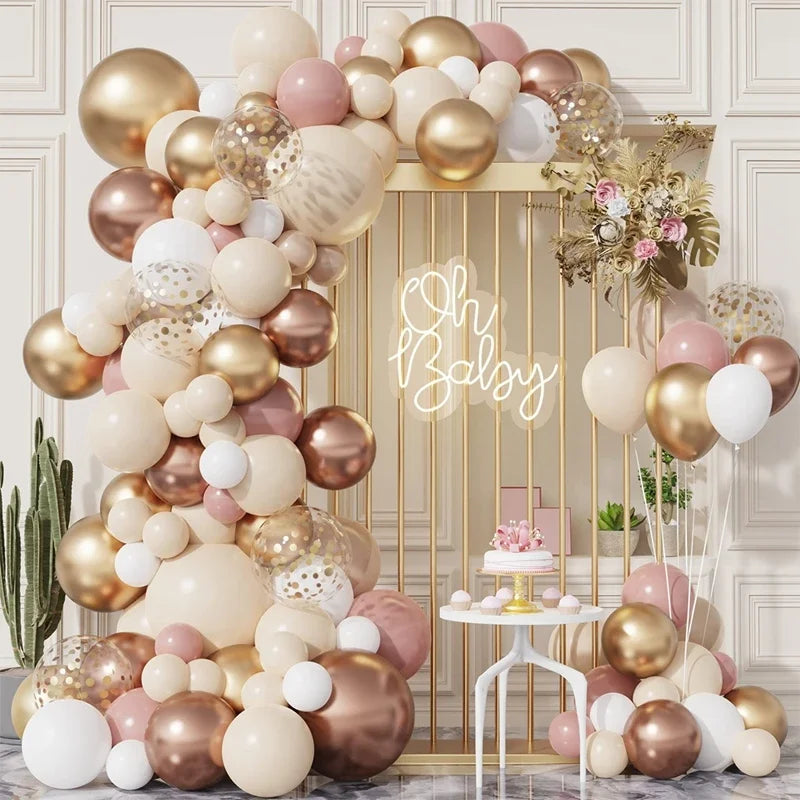 A vertical balloon garland featuring gold, rose gold, and white balloons arranged on a gold stand.