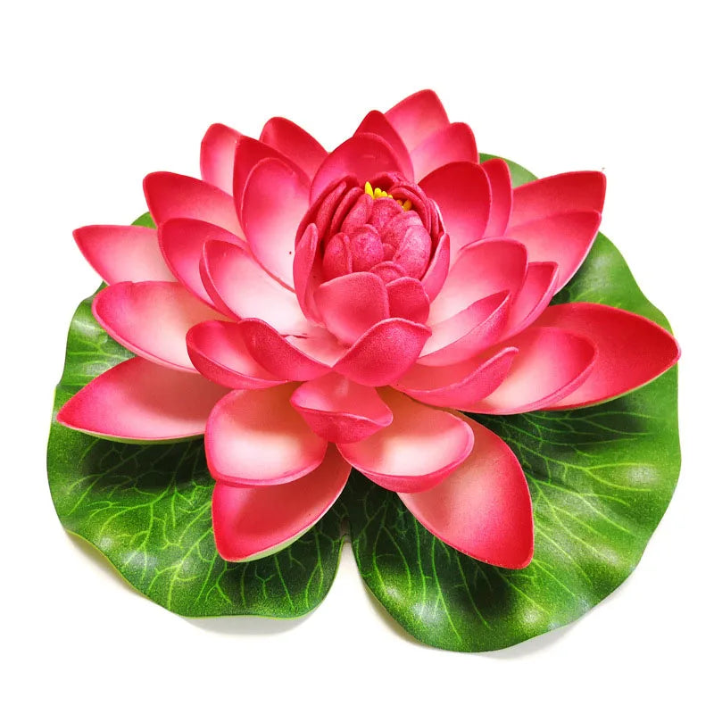 A vibrant pink artificial lotus flower with green leaves.