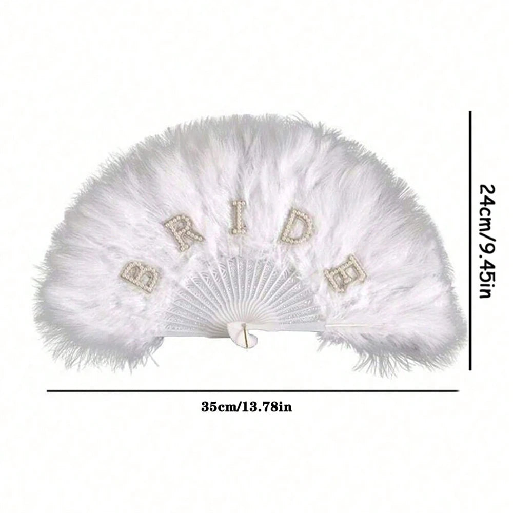 A white feather hand fan with a bridal theme featuring decorative elements and a fan shape.