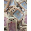 A collection of Rilakkuma plush ID card holders and keychains in various colors and designs.
