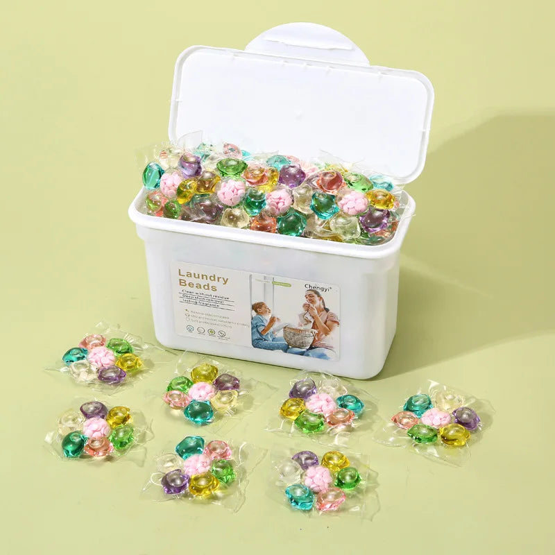 A white container filled with colorful laundry beads for stain removal and freshness.