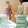 A woman models a green absorbent towel set in a bathroom setting, showing its texture and use for various activities.