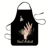Black apron with a hand decorated with gold glitter, featuring the text Nail Artist.